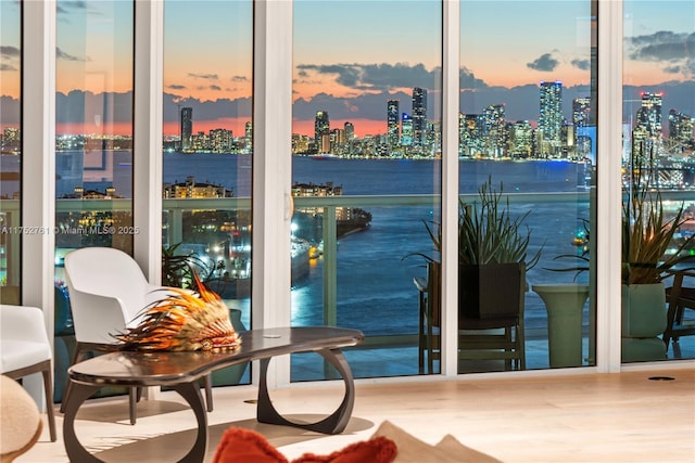 balcony at dusk featuring a city view