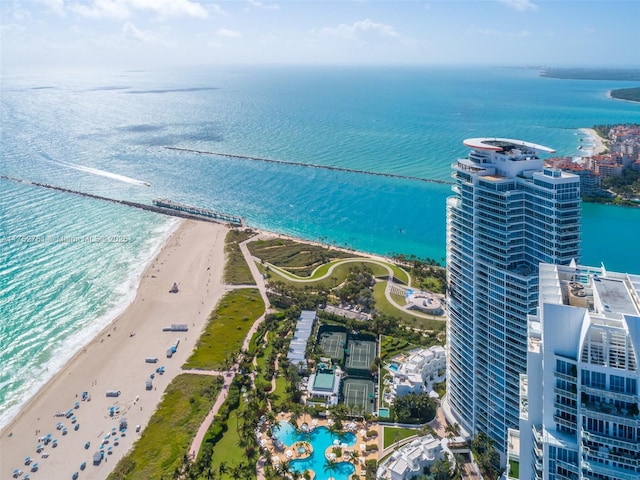 aerial view featuring a water view and a view of the beach