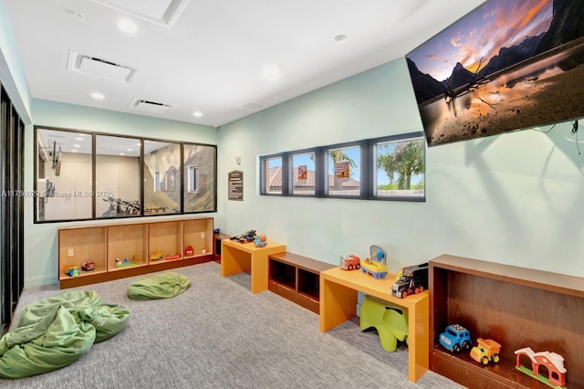 recreation room featuring visible vents, carpet floors, attic access, and recessed lighting