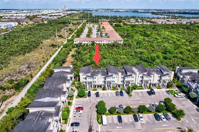 birds eye view of property with a residential view and a water view