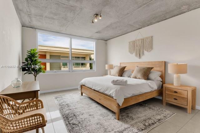 tiled bedroom with baseboards