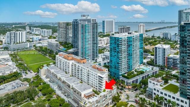 bird's eye view featuring a water view and a city view