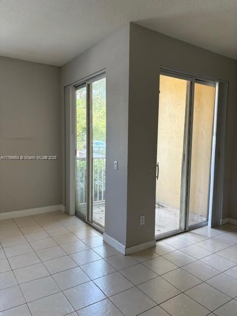 2111 Shoma Dr Unit 2111, Royal Palm Beach, FL 33414 - unfurnished room with light tile patterned flooring and a textured ceiling