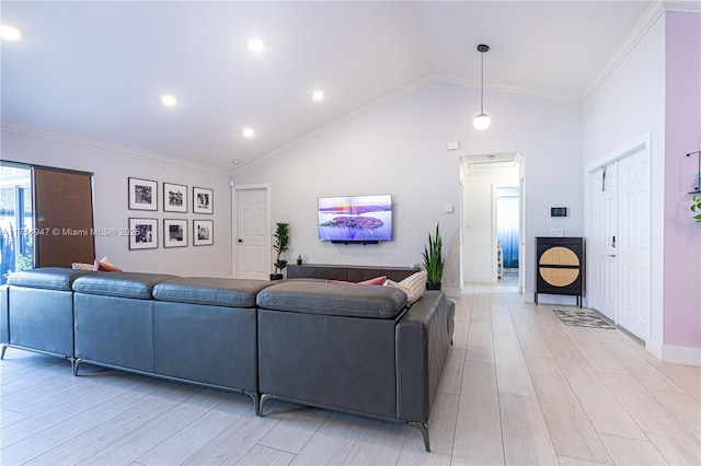 living room with light wood-type flooring, high vaulted ceiling, baseboards, and crown molding