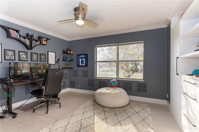 office area with light wood finished floors, ornamental molding, a ceiling fan, and baseboards