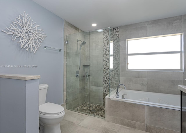 bathroom featuring a stall shower, tile patterned flooring, toilet, and a bath