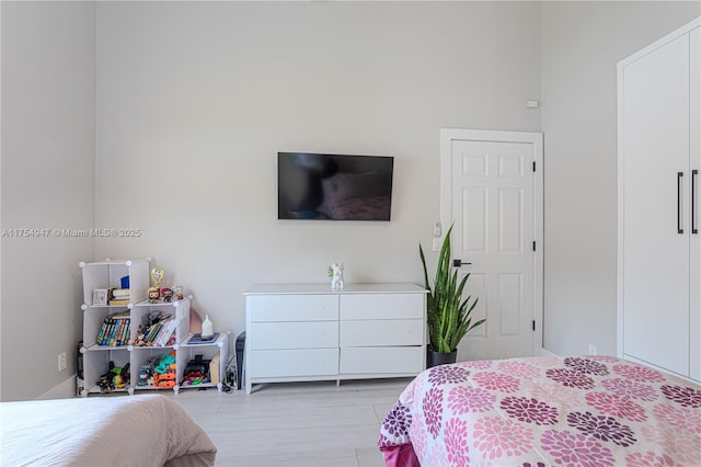 bedroom with light wood-style floors