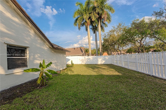 view of yard with a fenced backyard