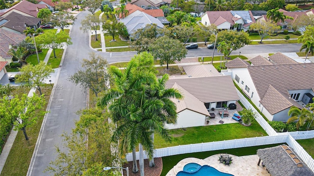 birds eye view of property with a residential view