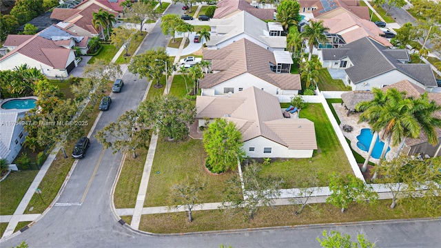 birds eye view of property with a residential view