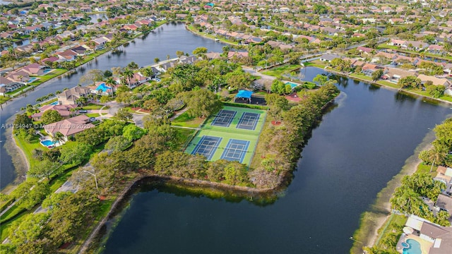 drone / aerial view with a residential view and a water view