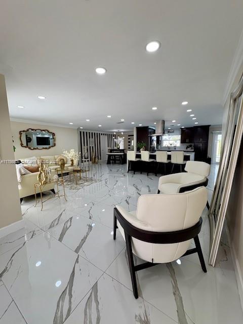 living room featuring recessed lighting, marble finish floor, crown molding, and baseboards