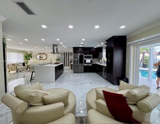 living area featuring marble finish floor, ornamental molding, visible vents, and recessed lighting