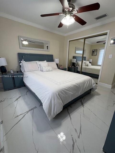 bedroom with marble finish floor, ornamental molding, a closet, and visible vents