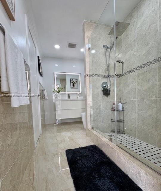 full bathroom featuring toilet, a shower stall, recessed lighting, and vanity