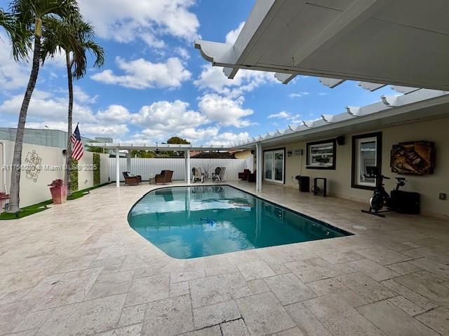 view of pool with a patio area, a fenced backyard, and a fenced in pool