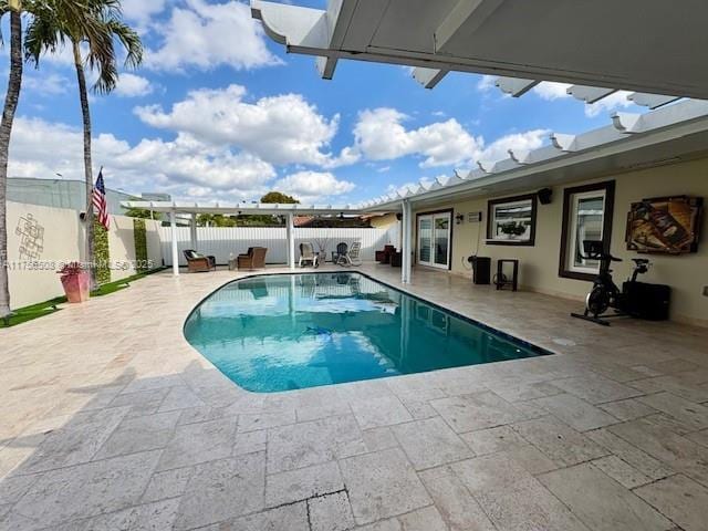 view of pool featuring a patio, fence, and a fenced in pool