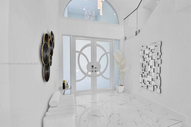 2578 NW 63rd Ln, Boca Raton, FL 33496 - entrance foyer featuring marble finish floor, french doors, and a high ceiling