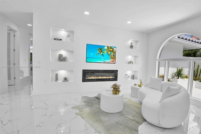 2578 NW 63rd Ln, Boca Raton, FL 33496 - living area featuring marble finish floor, built in features, and a glass covered fireplace