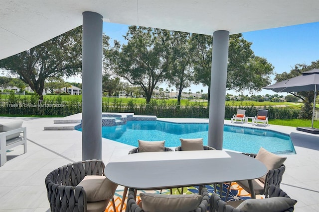 2578 NW 63rd Ln, Boca Raton, FL 33496 - view of swimming pool with a pool with connected hot tub, a patio area, fence, and outdoor dining area