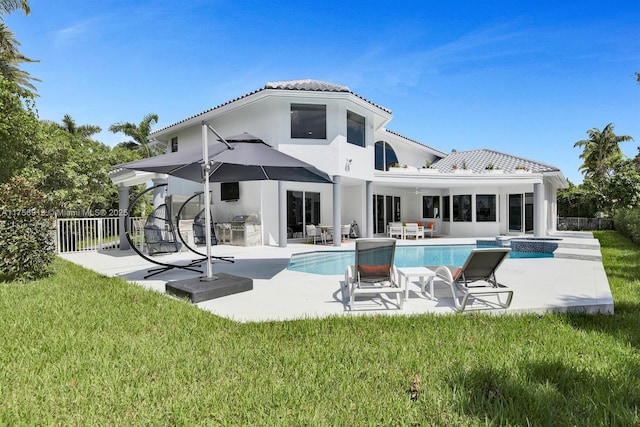 2578 NW 63rd Ln, Boca Raton, FL 33496 - rear view of property featuring a yard, a fenced backyard, a fenced in pool, and a patio