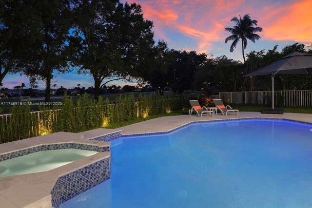 2578 NW 63rd Ln, Boca Raton, FL 33496 - view of pool with a fenced backyard, a pool with connected hot tub, and a patio