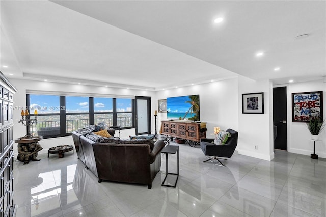 living room with baseboards and recessed lighting