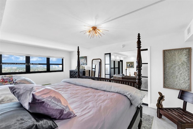 bedroom with a chandelier