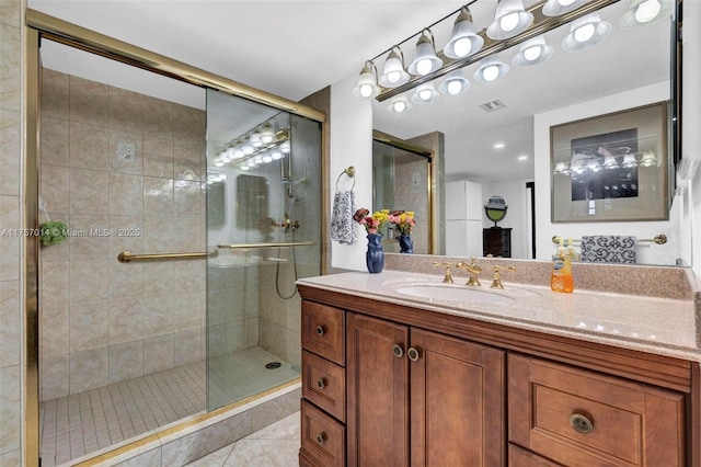 bathroom with a stall shower, visible vents, and vanity