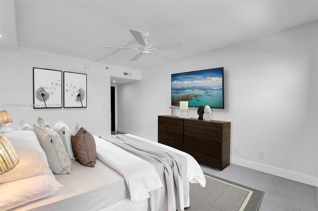 bedroom with a ceiling fan, visible vents, and baseboards