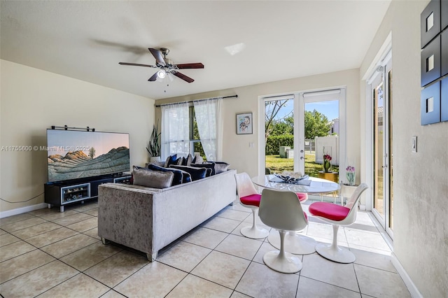 living area featuring ceiling fan, baseboards, french doors, and light tile patterned flooring