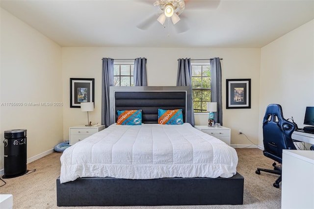 bedroom with carpet floors, baseboards, and a ceiling fan