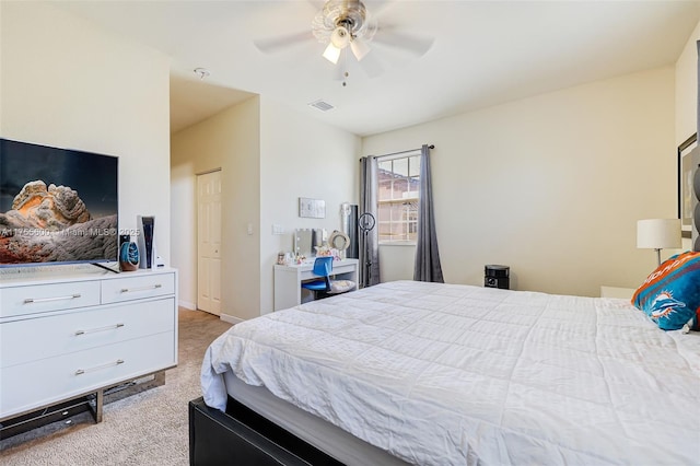 bedroom featuring baseboards, a ceiling fan, visible vents, and light colored carpet