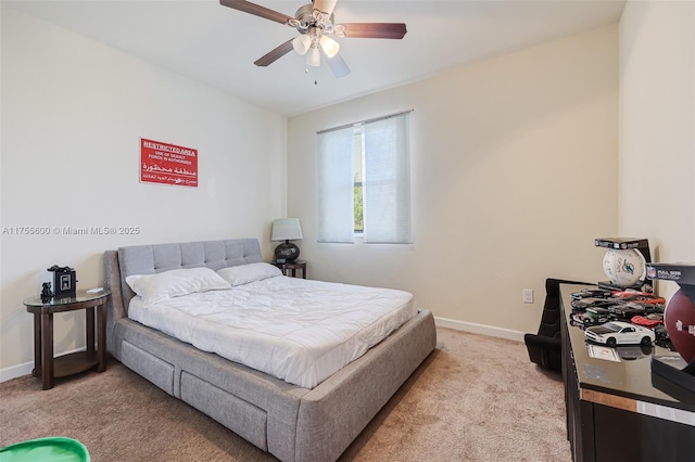 bedroom featuring light carpet, ceiling fan, and baseboards