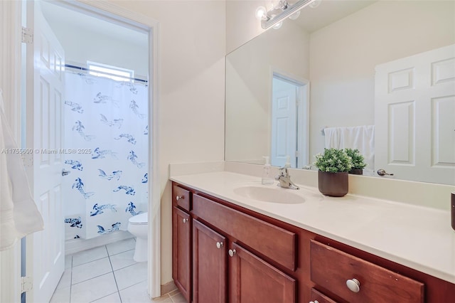 bathroom with tile patterned flooring, curtained shower, vanity, and toilet