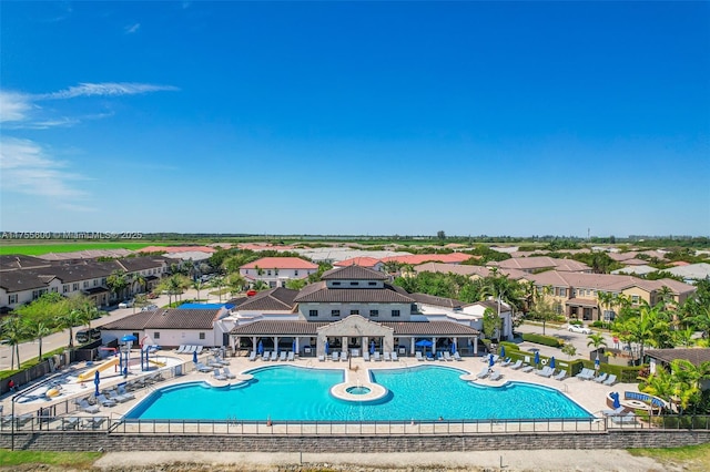 pool with a residential view, fence, a patio, and a gazebo