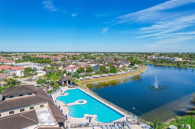 bird's eye view featuring a water view and a residential view