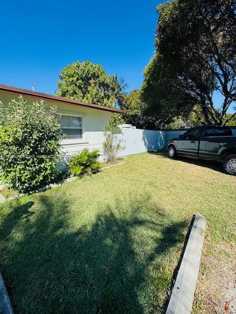 view of yard with fence