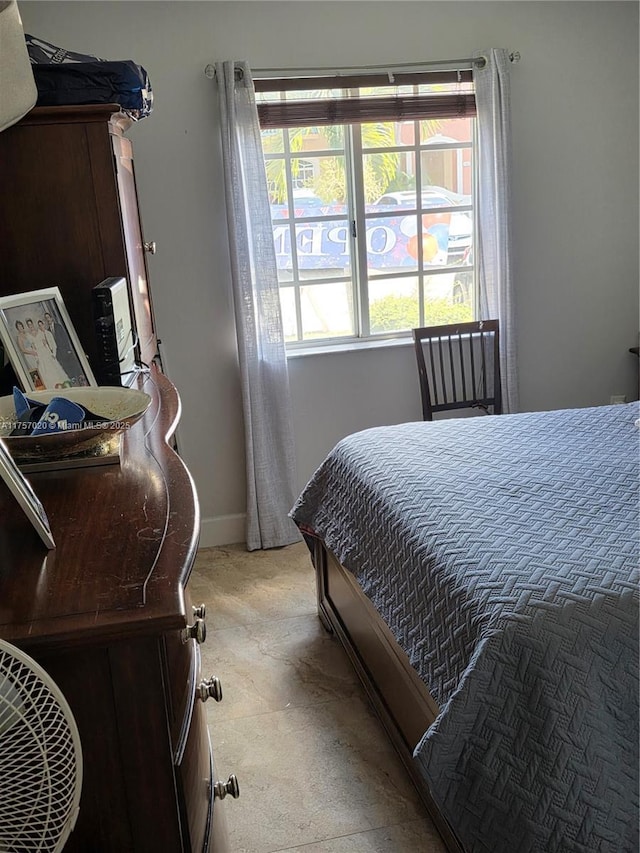 bedroom featuring baseboards