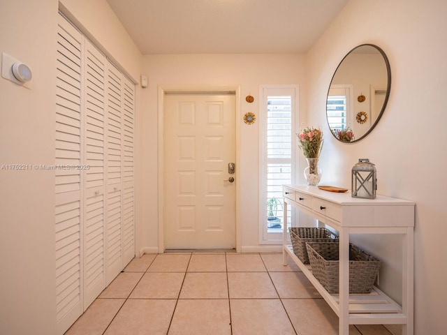 entryway featuring light tile patterned flooring