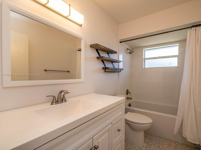 bathroom with toilet, tile patterned flooring, a tile shower, and vanity