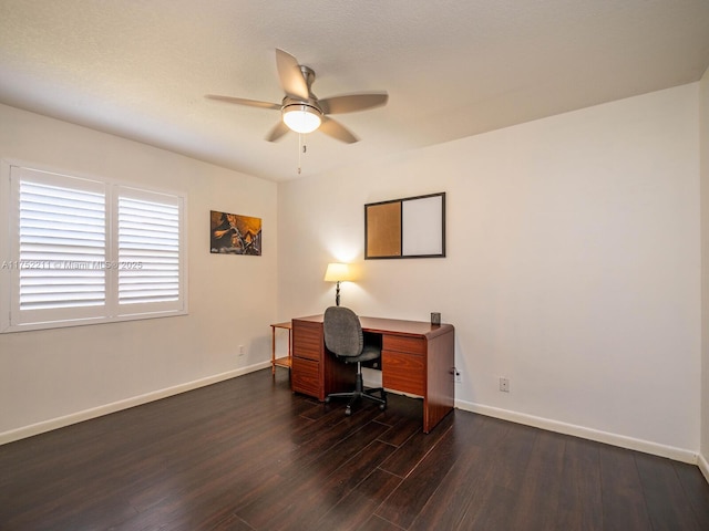 office space featuring ceiling fan, baseboards, and dark wood finished floors