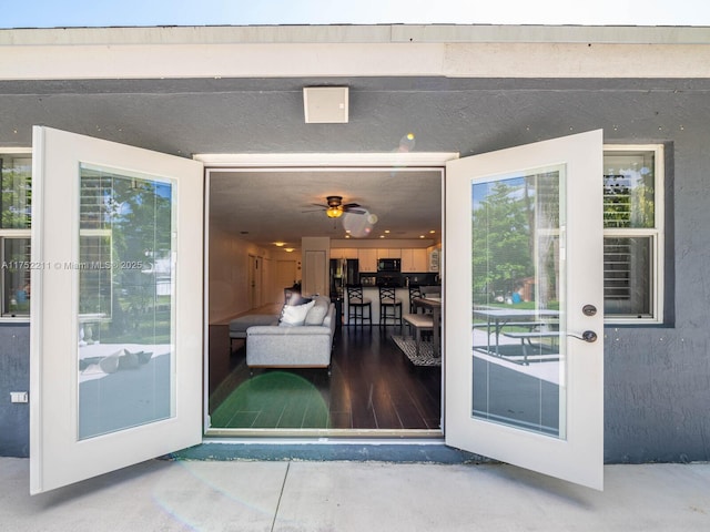 property entrance with stucco siding