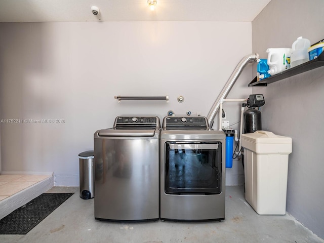 washroom featuring laundry area and washing machine and dryer