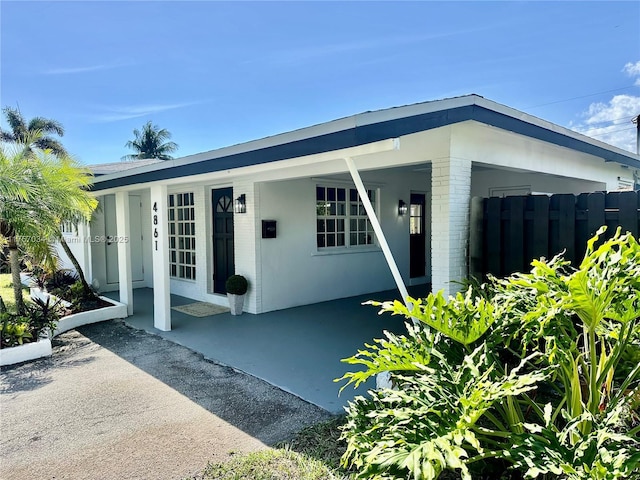 exterior space with fence and stucco siding