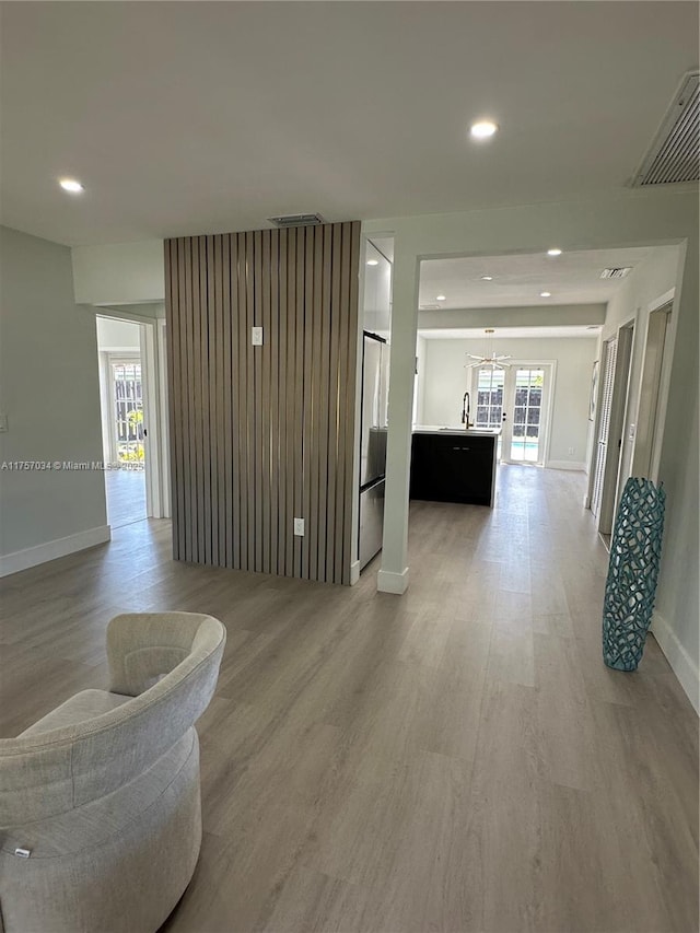 interior space with recessed lighting, a healthy amount of sunlight, visible vents, and light wood-style flooring