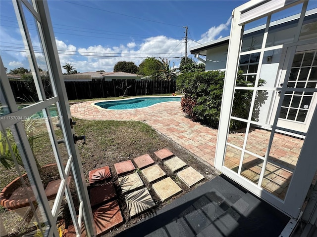 view of pool with a fenced in pool, a patio area, and a fenced backyard