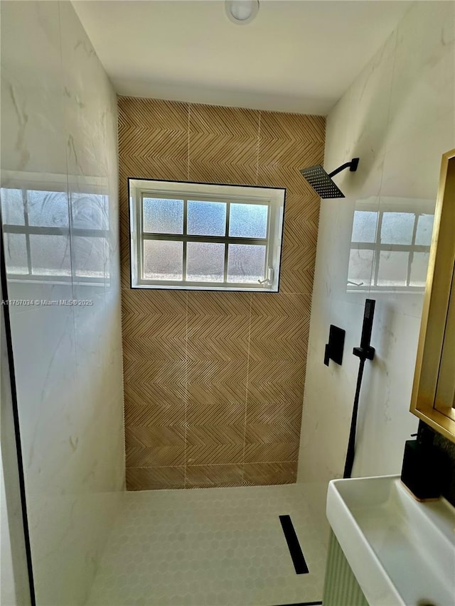 bathroom featuring a sink and walk in shower