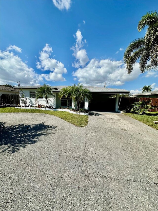 property entrance featuring a carport