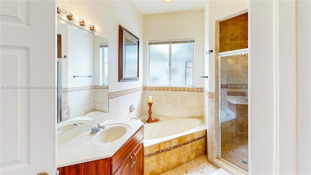 full bathroom with tile patterned floors, a shower stall, a bath, and vanity